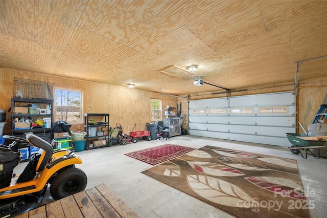 garage with wooden ceiling and a garage door opener