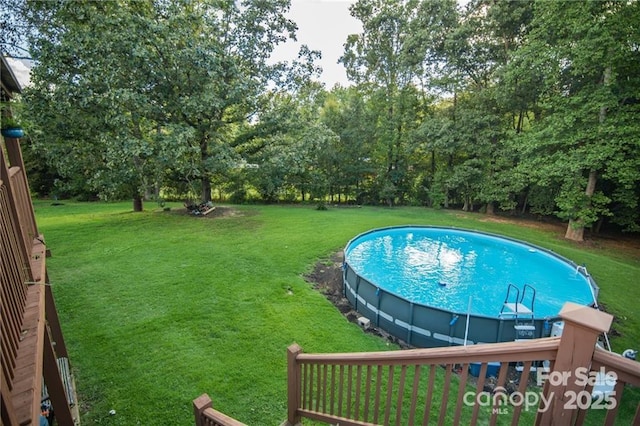 outdoor pool with a yard