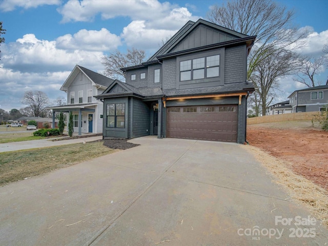 view of front of home with driveway, board and batten siding, and an attached garage