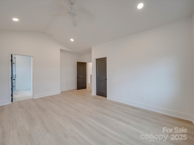 empty room featuring light wood finished floors, baseboards, lofted ceiling, ceiling fan, and recessed lighting