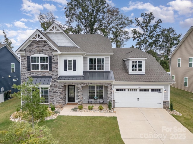 craftsman inspired home featuring a shingled roof, a front lawn, covered porch, driveway, and a standing seam roof