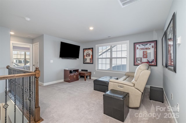 carpeted living room with recessed lighting, baseboards, and visible vents