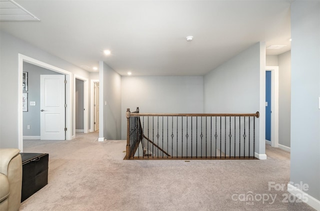 corridor with an upstairs landing, carpet flooring, recessed lighting, and baseboards