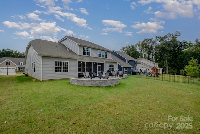 back of property featuring a yard, a playground, fence, and a patio area