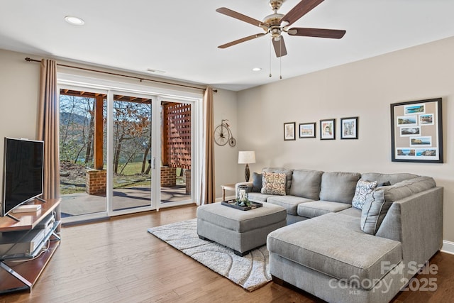 living room featuring recessed lighting, wood finished floors, and a ceiling fan