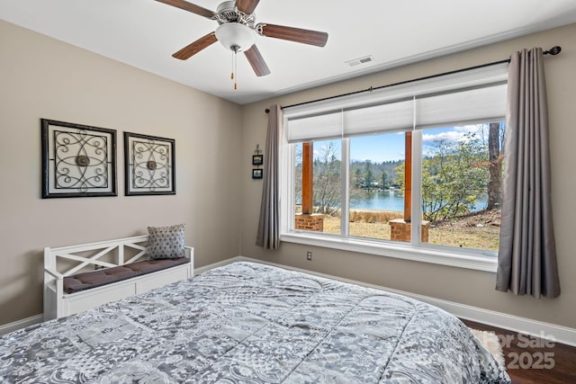 bedroom with visible vents and baseboards