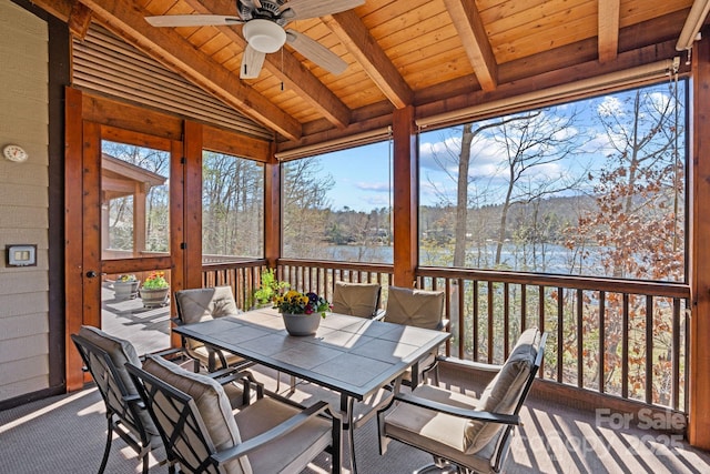 sunroom / solarium featuring wood ceiling, vaulted ceiling with beams, and a ceiling fan