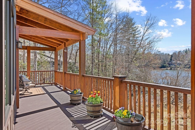 wooden deck with a water view