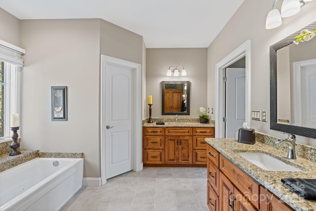 bathroom featuring a sink, a garden tub, two vanities, and tile patterned floors