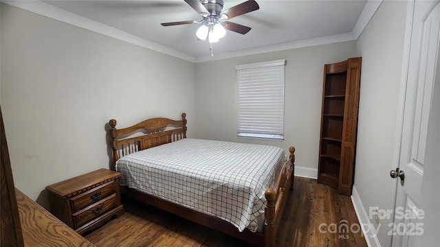 bedroom with crown molding, wood finished floors, baseboards, and ceiling fan