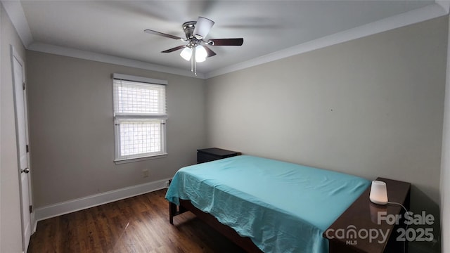 bedroom featuring ceiling fan, baseboards, wood finished floors, and ornamental molding