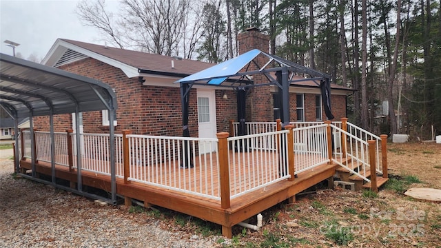 deck featuring a detached carport