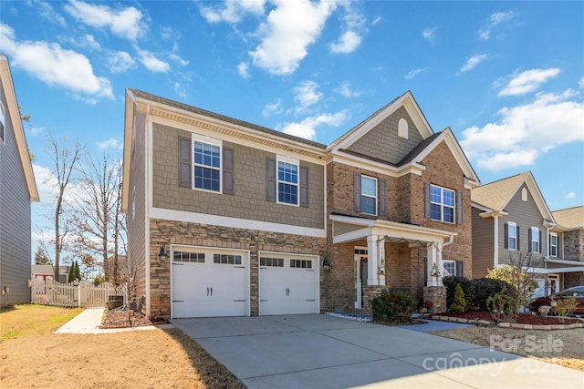 craftsman-style home featuring stone siding, concrete driveway, a garage, and fence