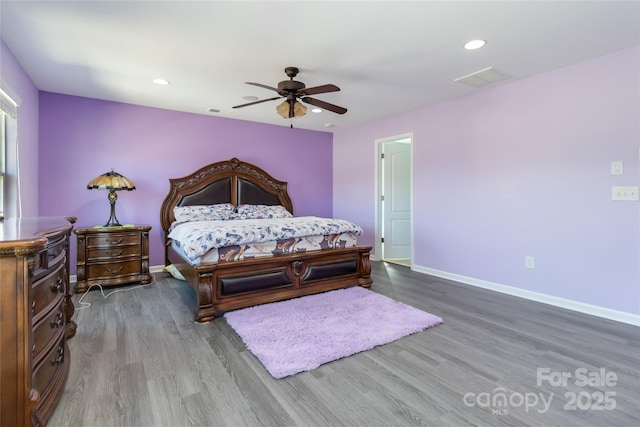 bedroom with recessed lighting, wood finished floors, baseboards, and ceiling fan