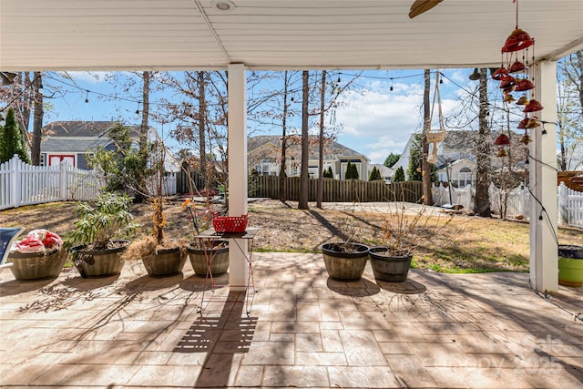 view of patio featuring a ceiling fan and a fenced backyard