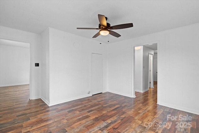 spare room with ceiling fan and wood finished floors