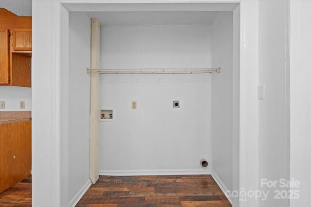 laundry room with hookup for a washing machine, laundry area, dark wood-type flooring, baseboards, and electric dryer hookup