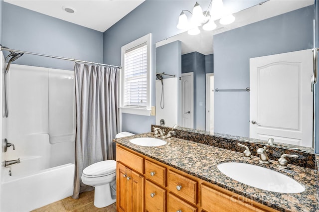 full bathroom with tile patterned floors, toilet, shower / bath combo with shower curtain, and a sink