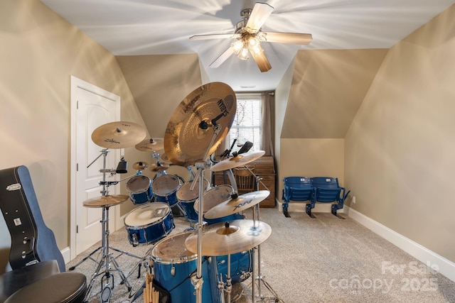 interior space with baseboards, carpet floors, lofted ceiling, and ceiling fan