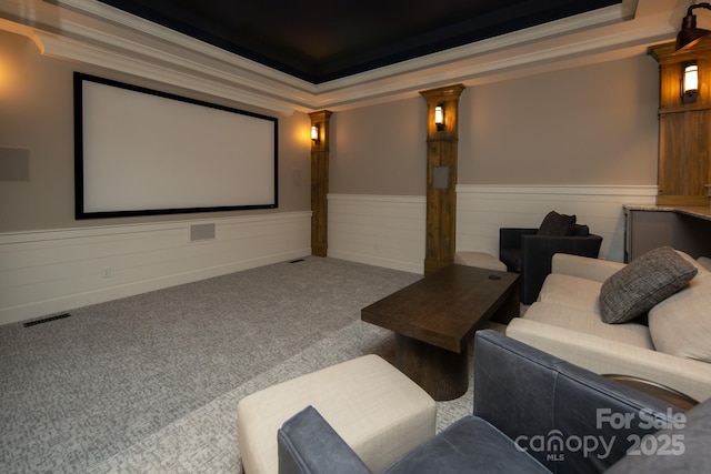 14 Twinflower Trl, Asheville, NC 28804 - carpeted home theater room with crown molding, a tray ceiling, wainscoting, and visible vents