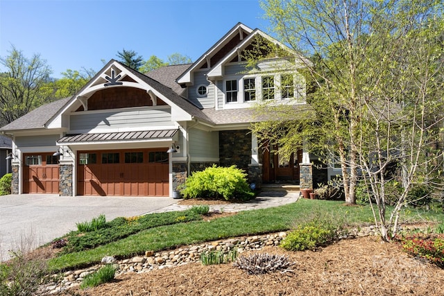 14 Twinflower Trl, Asheville, NC 28804 - craftsman-style house with an attached garage, stone siding, driveway, and roof with shingles