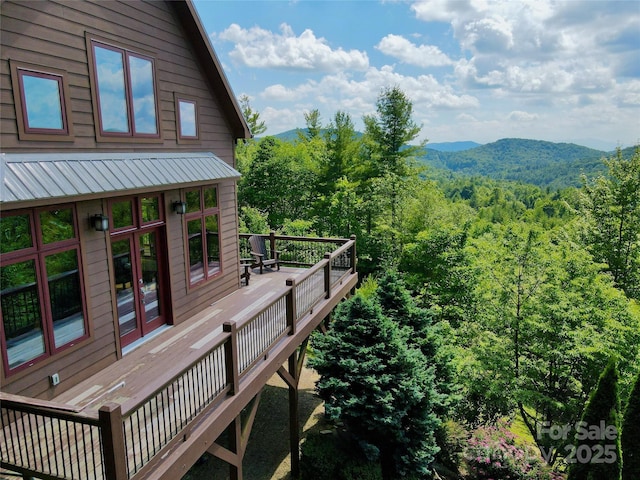 exterior space featuring a forest view