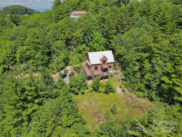 aerial view featuring a view of trees