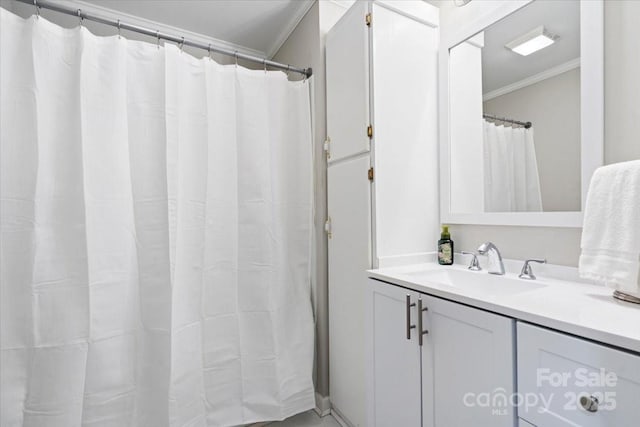 full bathroom featuring crown molding and vanity