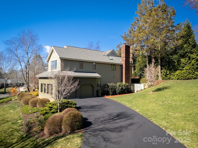 205 Midland Dr, Asheville, NC 28804 - view of front of home with driveway, a chimney, a front lawn, a shingled roof, and a garage