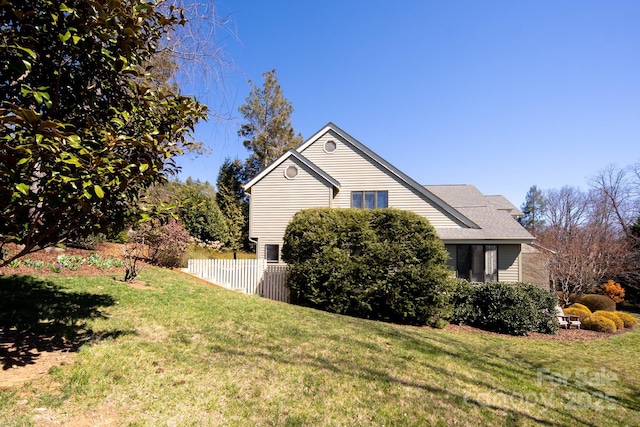 205 Midland Dr, Asheville, NC 28804 - view of home's exterior featuring a shingled roof, fence, and a yard