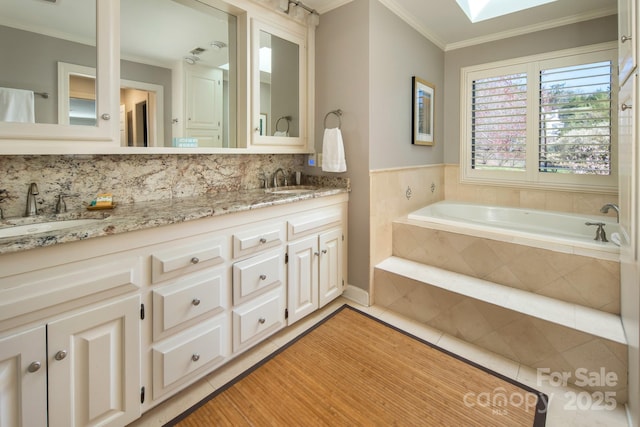 205 Midland Dr, Asheville, NC 28804 - full bath featuring crown molding, tile patterned floors, a sink, double vanity, and a bath