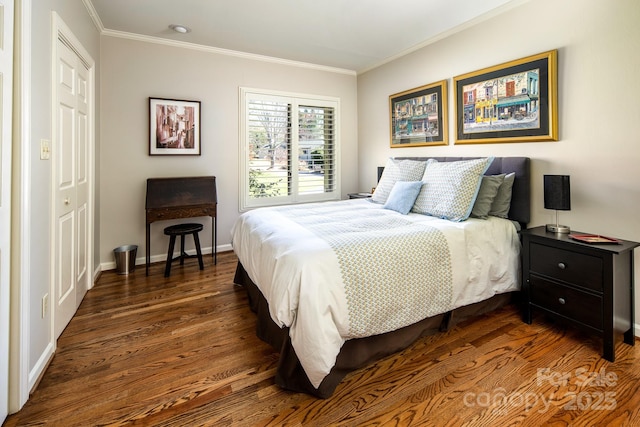 205 Midland Dr, Asheville, NC 28804 - bedroom featuring dark wood-style floors, a closet, baseboards, and ornamental molding
