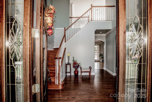 4907 White Oak Ln, Denver, NC 28037 - entrance foyer with arched walkways, wood finished floors, ornamental molding, a high ceiling, and stairs