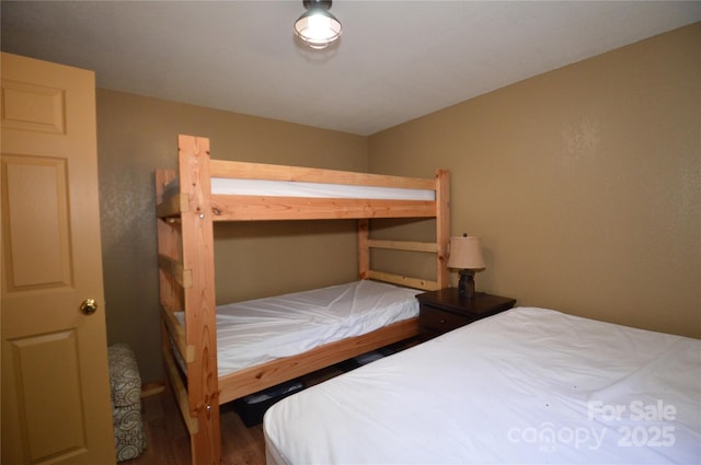 bedroom featuring wood finished floors