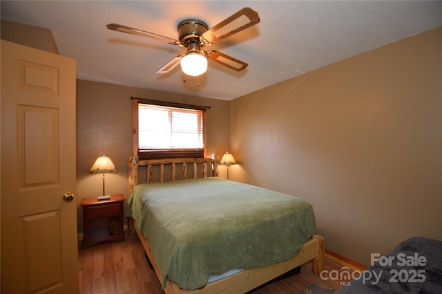 bedroom featuring ceiling fan and light wood-type flooring