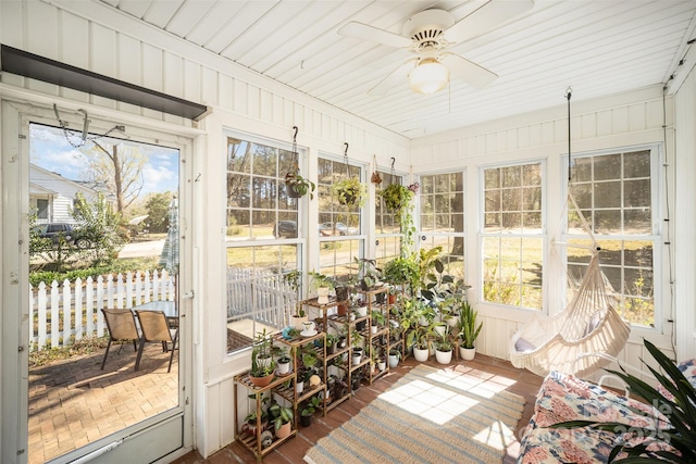 sunroom with a ceiling fan