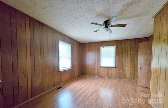 410 Cole Campbell Rd, Taylorsville, NC 28681 - unfurnished room featuring ceiling fan, a healthy amount of sunlight, visible vents, and light wood-style flooring