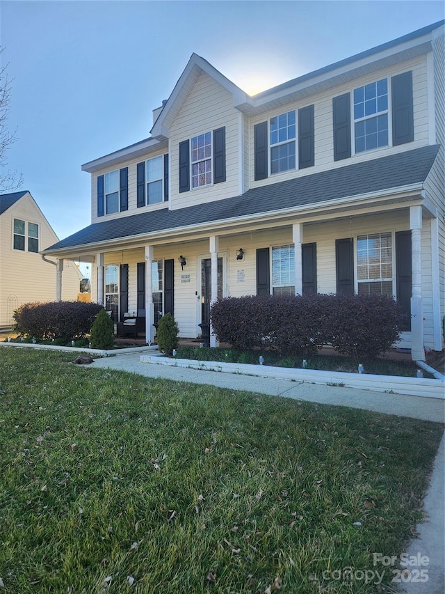 view of front facade with a porch and a front yard