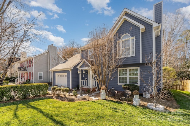 view of front of home featuring a front lawn, a chimney, an attached garage, and fence