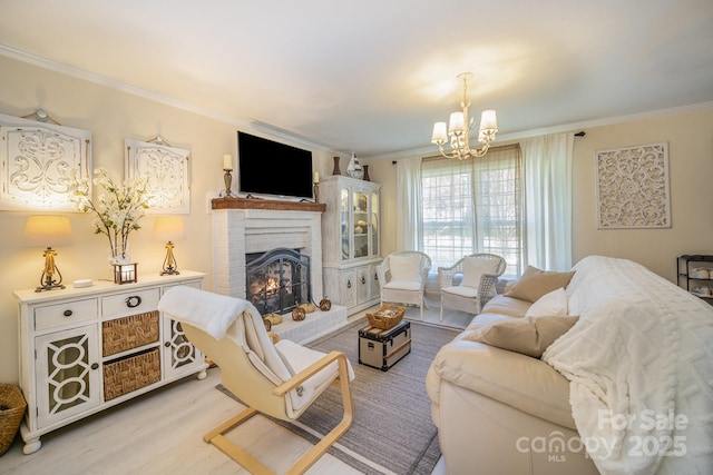 living room with a brick fireplace, wood finished floors, and crown molding