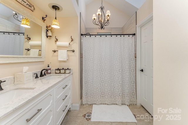 bathroom featuring double vanity, an inviting chandelier, a sink, and a shower with shower curtain