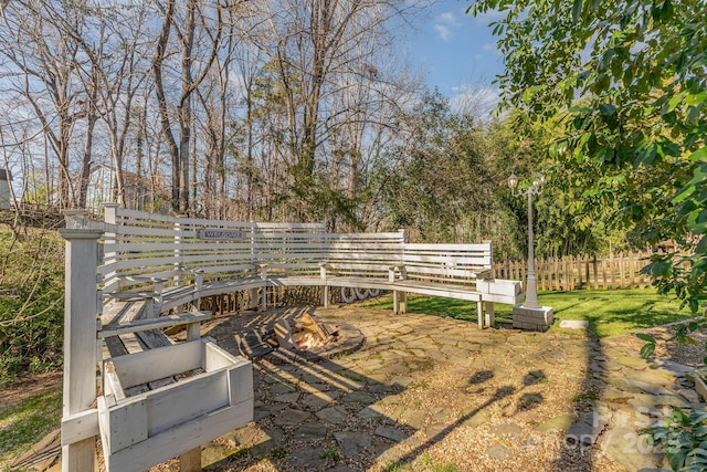 view of yard featuring fence and a patio