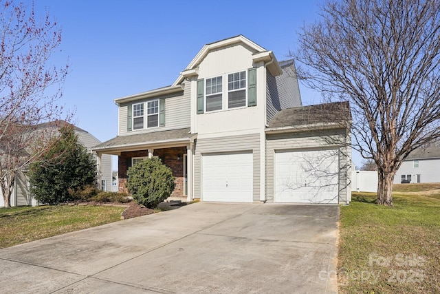 traditional-style house featuring a front lawn, a garage, and driveway