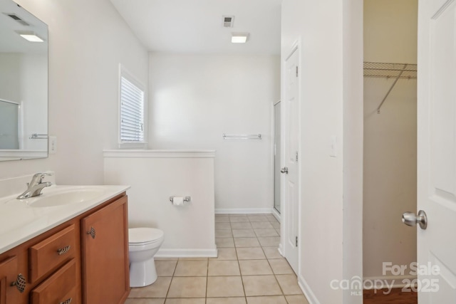 full bath featuring tile patterned floors, visible vents, toilet, a stall shower, and vanity