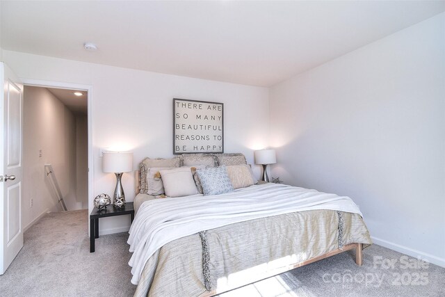 carpeted bedroom with baseboards