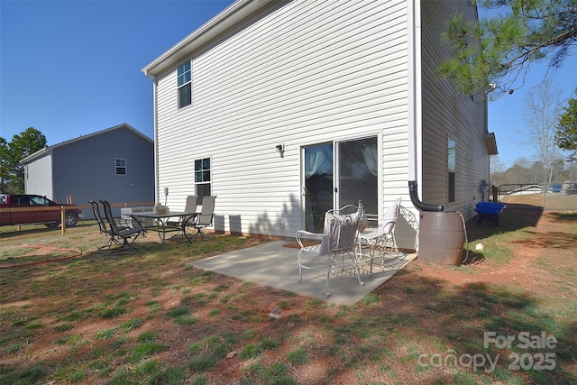 rear view of property featuring a patio area