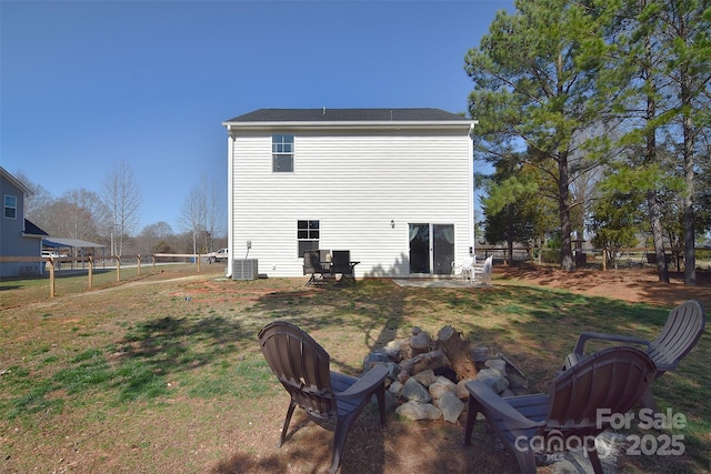 back of property featuring central air condition unit, a lawn, a patio, and fence