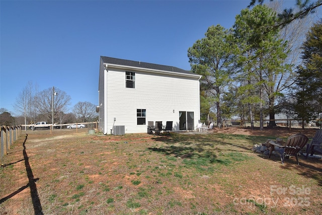 back of house featuring a patio area, a lawn, cooling unit, and fence