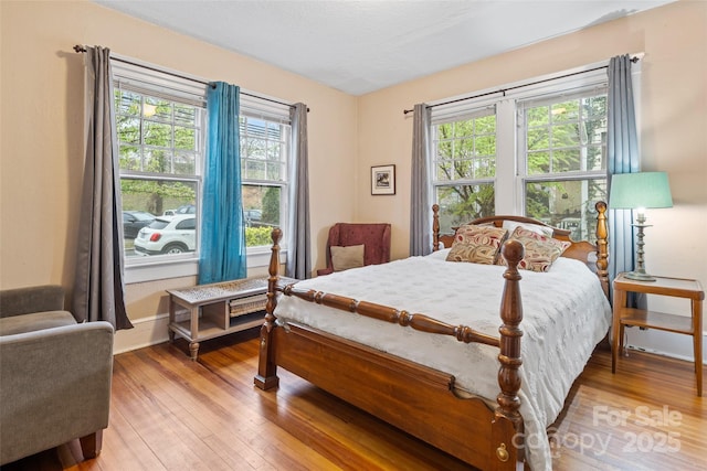 bedroom featuring light wood-style floors