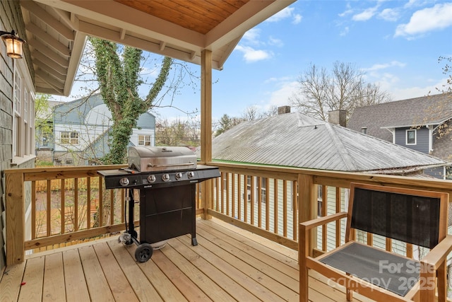 wooden deck featuring grilling area